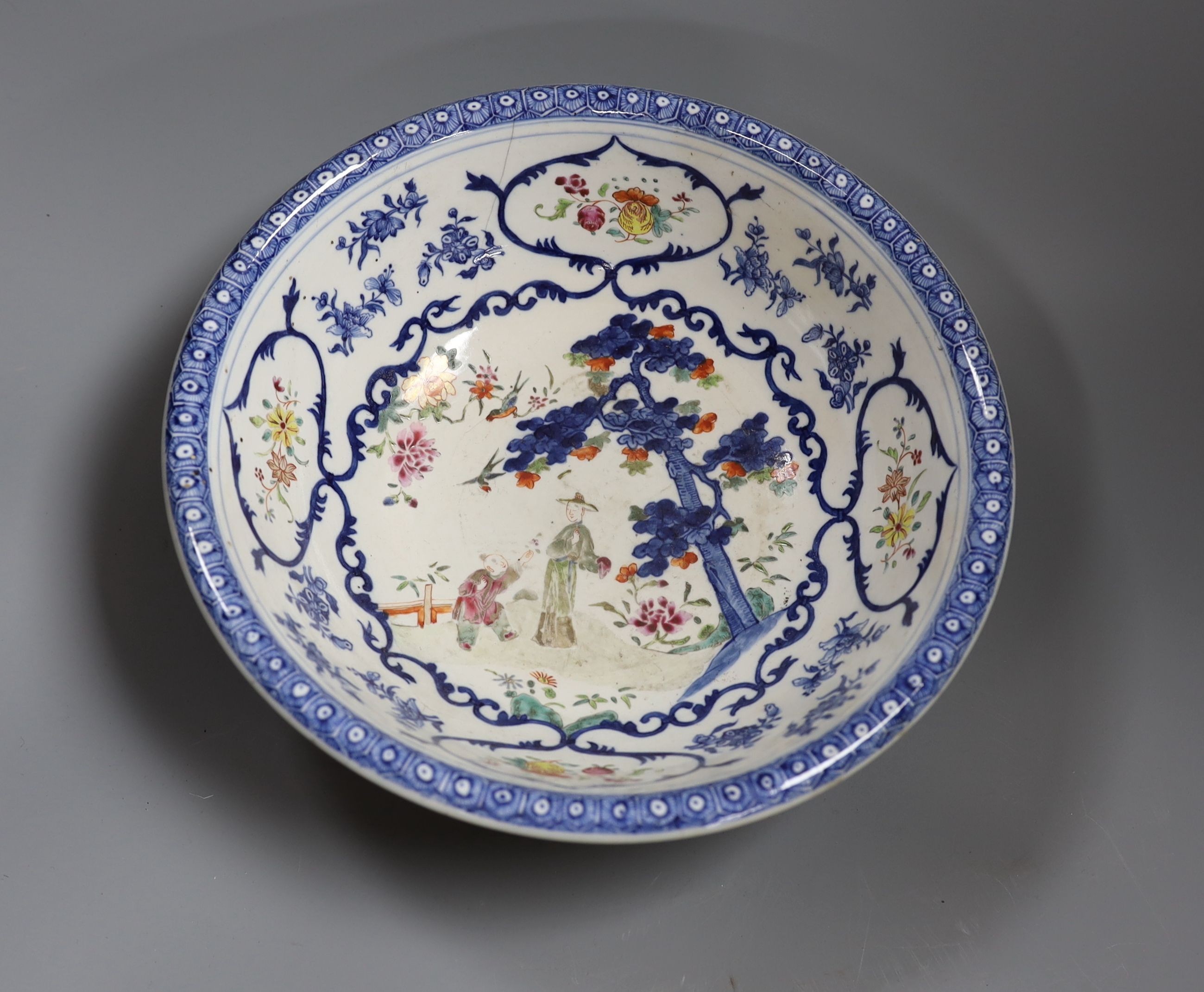 A Chinese underglaze blue and famille rose decorated basin or bowl, Qianlong period, 27 cm diameter